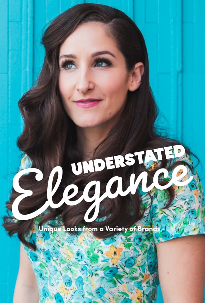 Woman in floral dress against teal wall